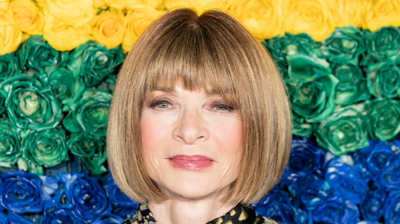 Anna Wintour with floral background