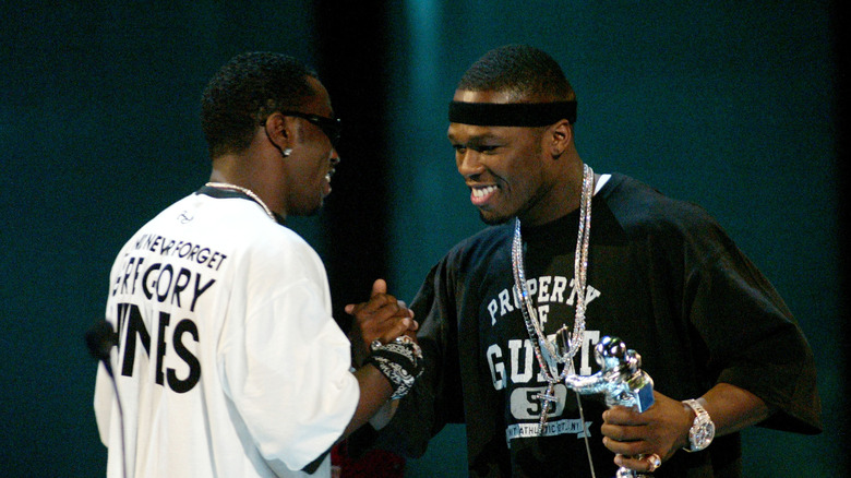 Sean Combs presenting 50 Cent with an award