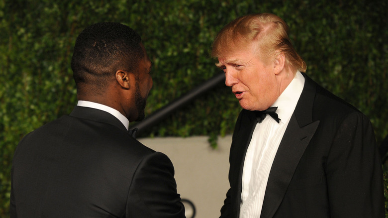 50 Cent and Donald Trump greeting each other 