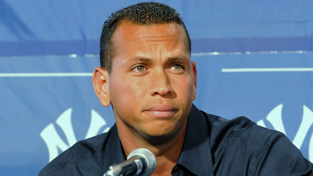 Alex Rodriguez furrowing his brow at a press conference 