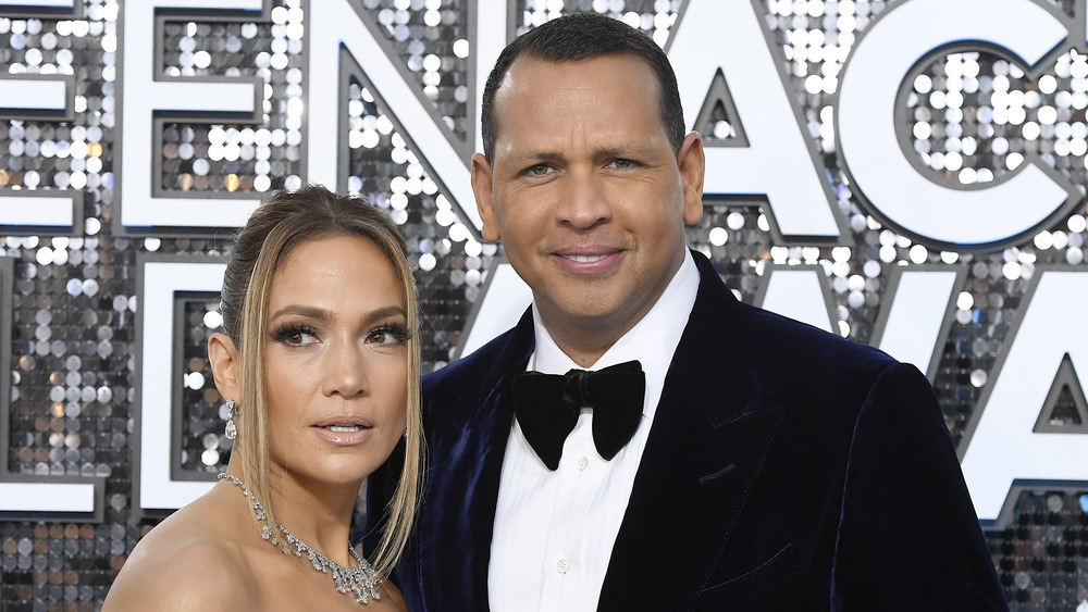 Alex Rodriguez laughing in a tuxedo