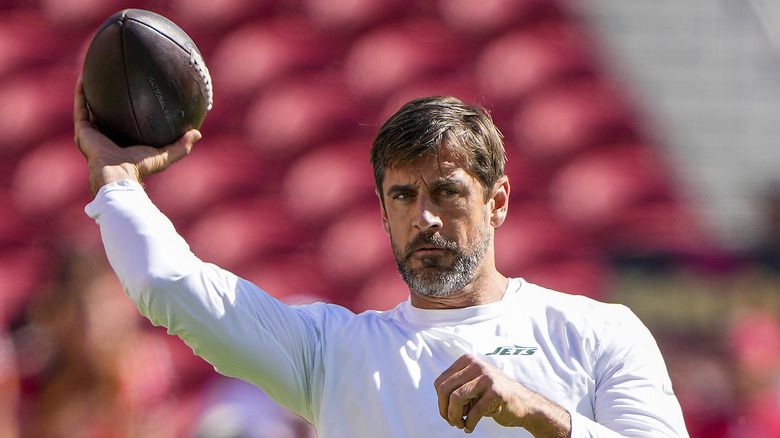 Aaron Rodgers warming up on field