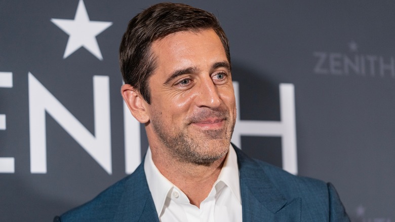 Aaron Rodgers smiling on red carpet