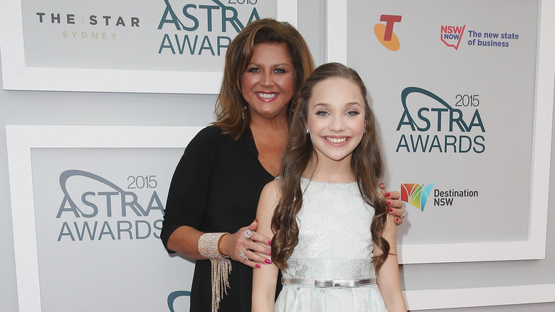 Abby Lee Miller and Maddie Ziegler smiling together at event