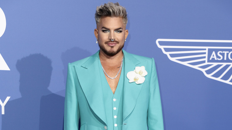 Adam Lambert wearing teal suit