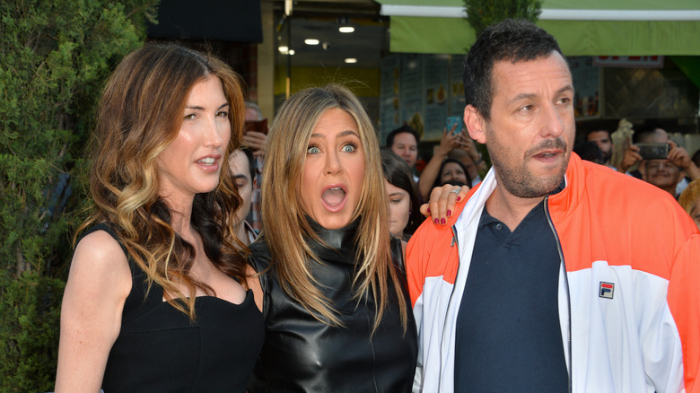 Adam Sandler with his wife and Jennifer Aniston