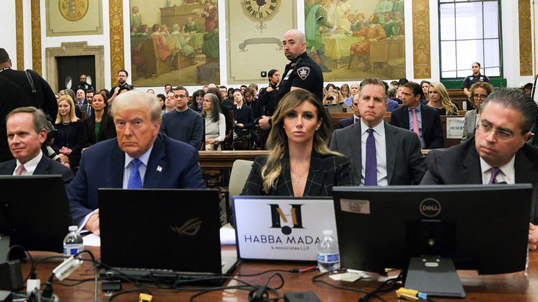 Alina Habba with Donald Trump and lawyers