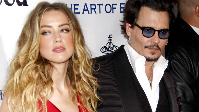 Amber Heard and Johnny Depp posing  