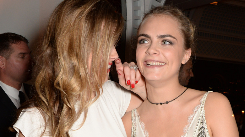 Amber Heard and Cara Delevingne laughing 