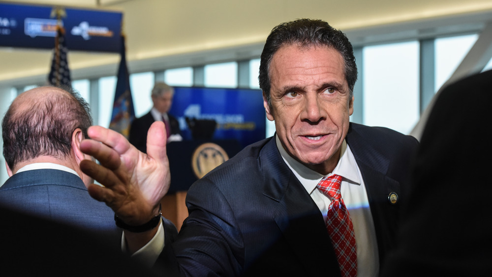 Andrew Cuomo waving at the airport