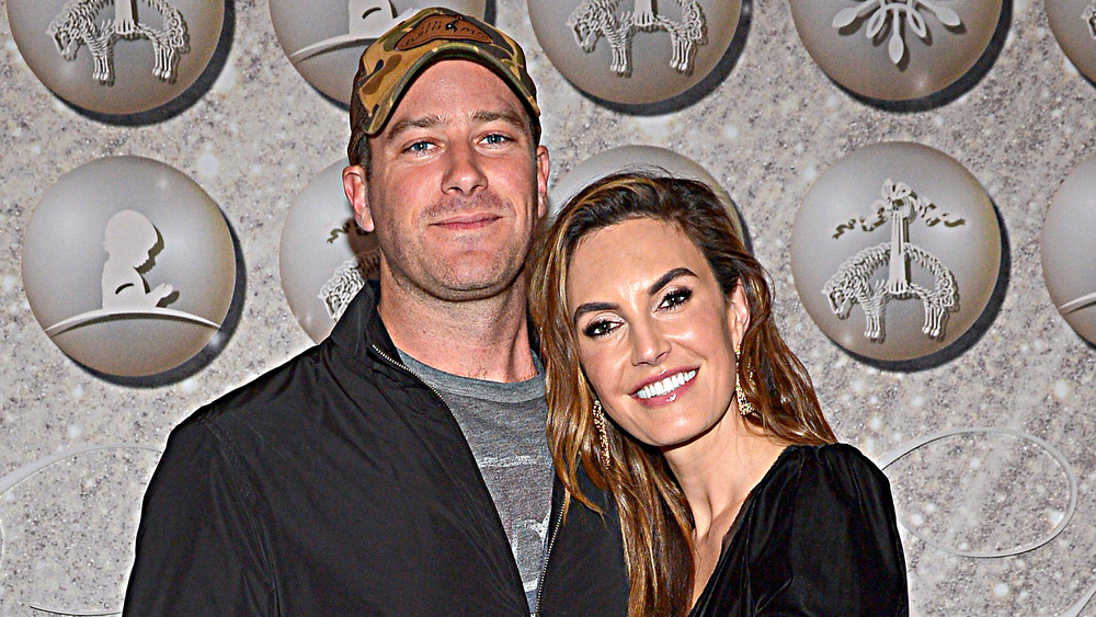 Armie Hammer and Elizabeth Chambers smiling in 2019