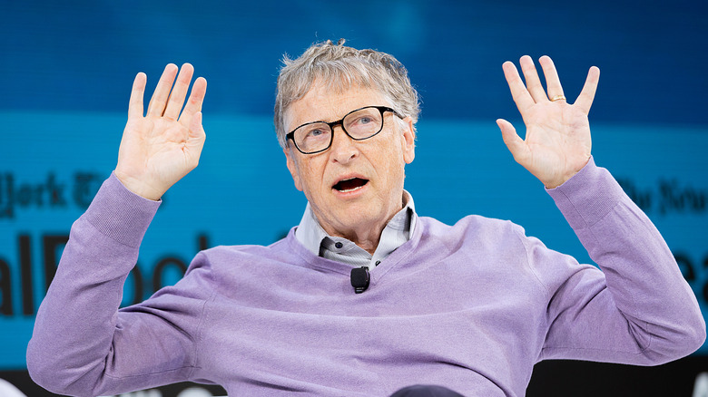 Bill Gates hands up in the air