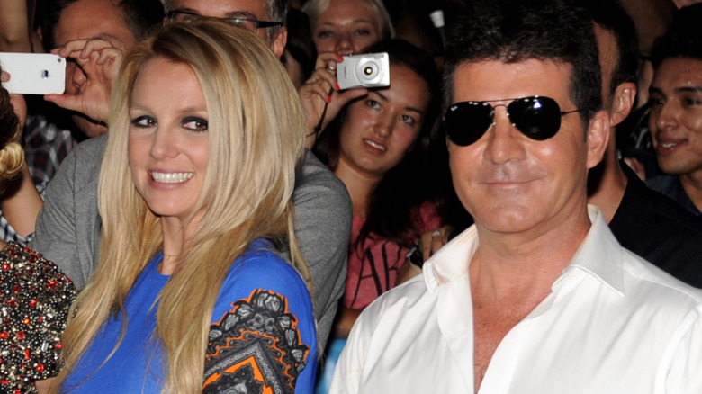 Britney Spears, Simon Cowell smiling