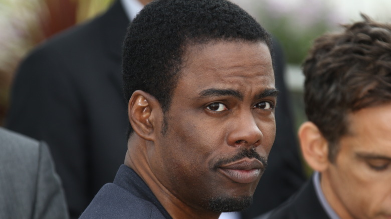 Chris Rock looking to the side