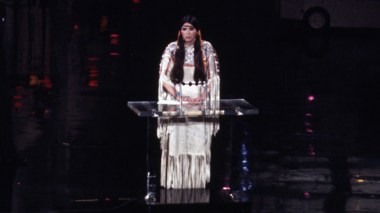 Sacheen Littlefeather speaking on stage at the 1973 Oscars