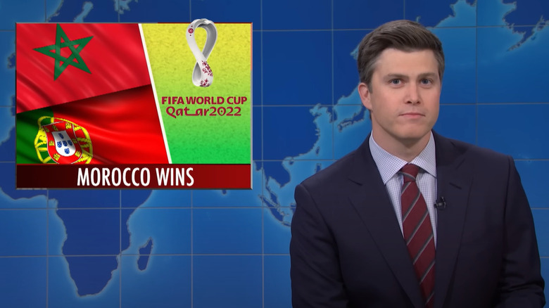 Colin Jost with over-the-shoulder World Cup graphic 