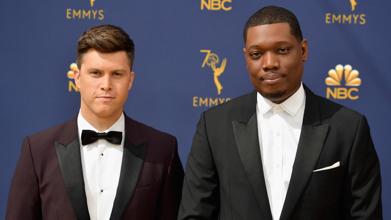 Colin Jost Michael Che posing