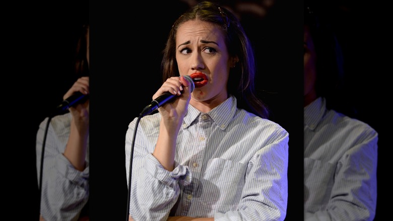 Colleen Ballinger speaking on stage as Miranda Sings