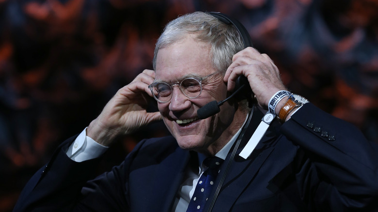 David Letterman's hands on ears