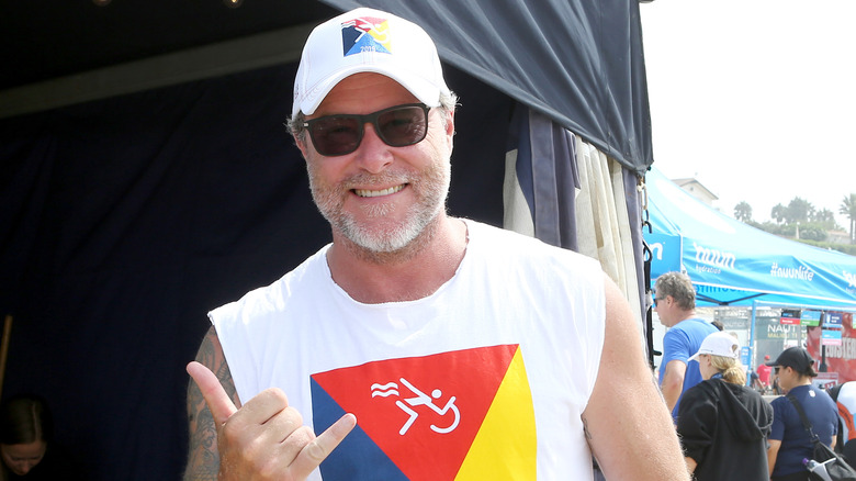 Dean McDermott in white tank top and baseball cap