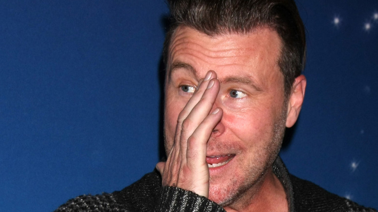 Dean McDermott, appears to be upset