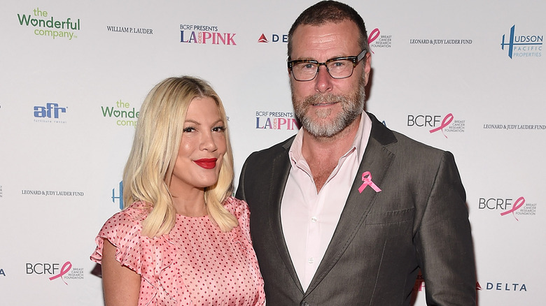 Dean McDermott and Tori Spelling on red carpet