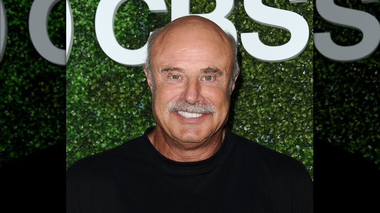 Dr. Phil poses for a photo at a CBS event