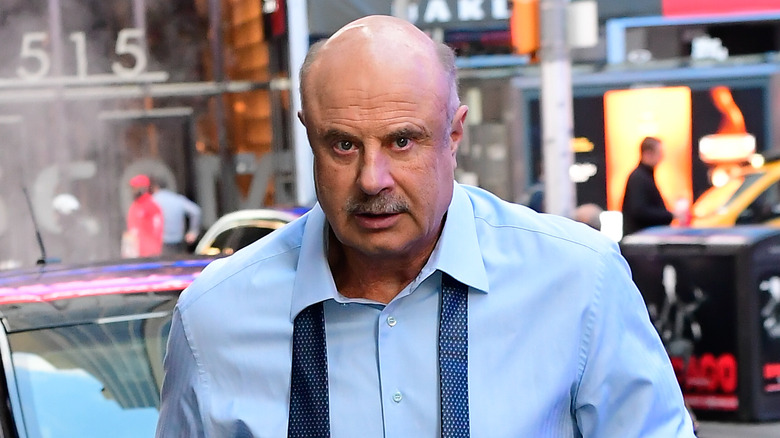 Dr. Phil walks outside the 'Good Morning America' set