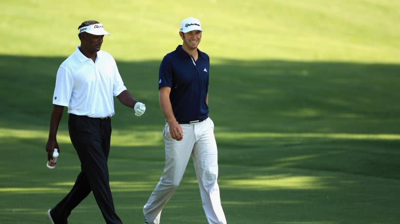 Vijay Singh, Dustin Johnson walking side by side during a 2011 match