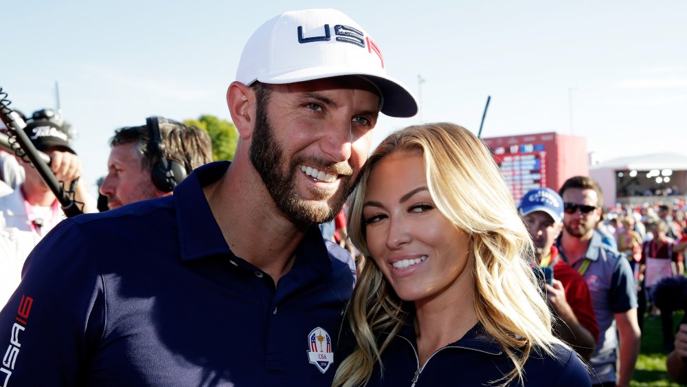 Dustin Johnson and Paulina Gretzky, arm in arm and smiling