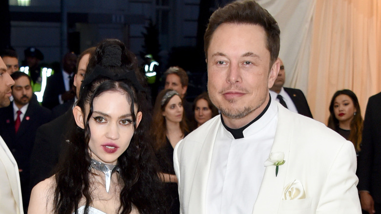 Grimes and Elon Musk smiling 