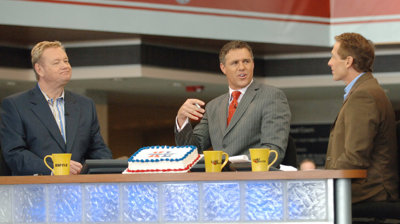 Cold Pizza anchors sitting at desk