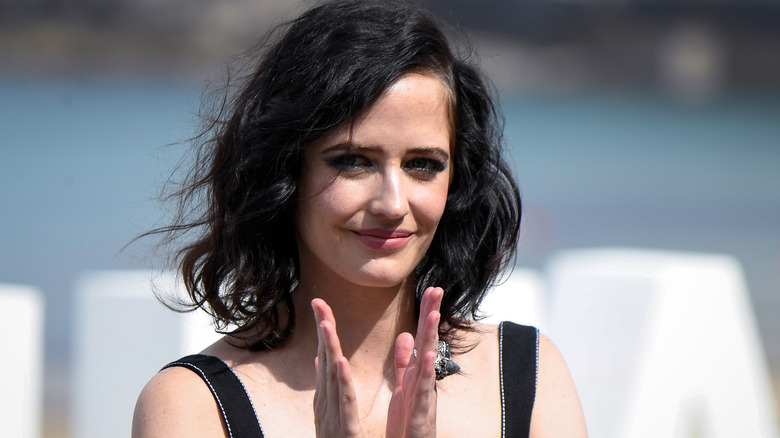 Eva Green clapping at event