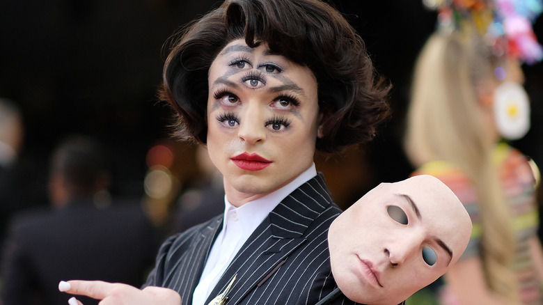 Ezra Miller posing with mask