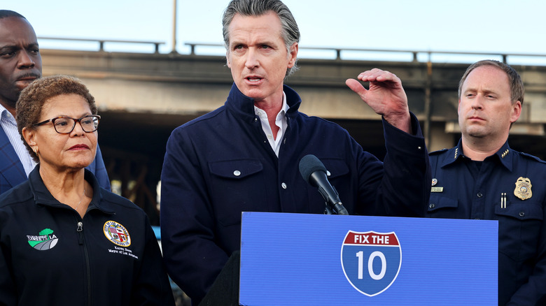 Gavin Newsom behind a podium 