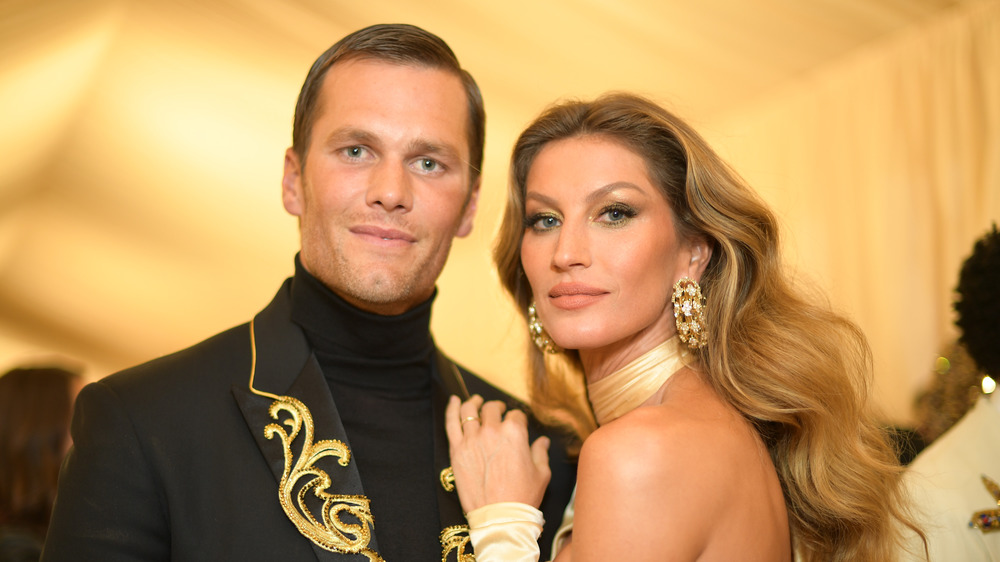 Tom Brady and Gisele Bundchen smiling at the MET Gala 