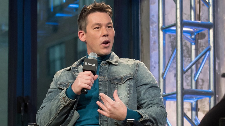 David Bromstad gesturing to himself during an interview.