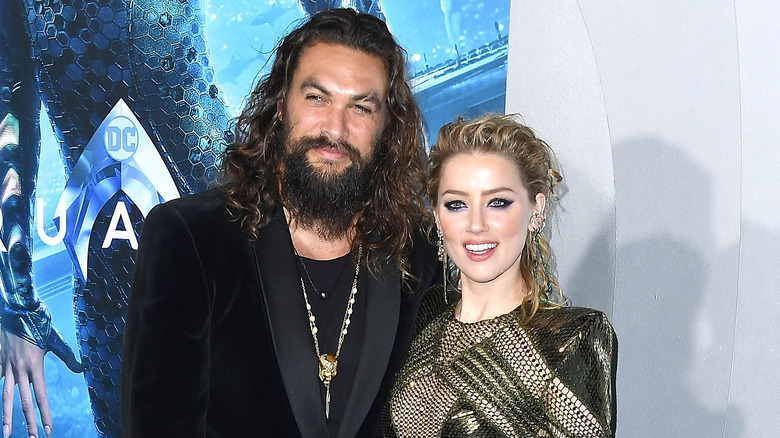 Jason Momoa and Amber Heard on a red carpet