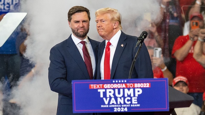 JD Vance and Donald Trump shaking hands at campaign event