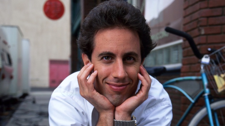 Jerry Seinfeld posing with his hands on his chin