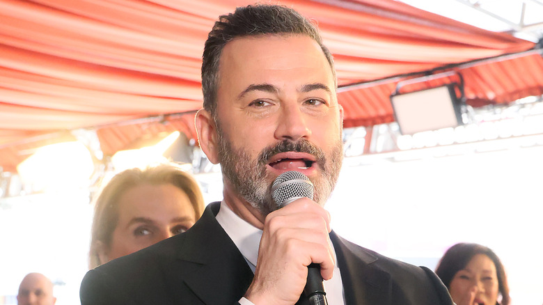 Jimmy Kimmel speaking into a microphone