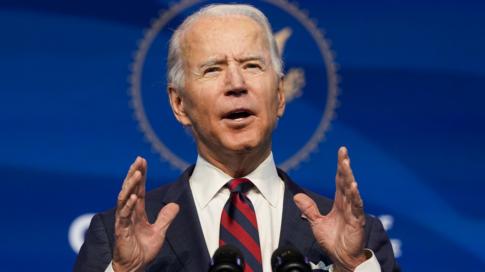 Joe Biden with his hands raised