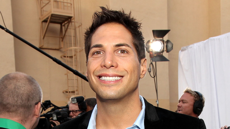 Joe Francis smiling on set