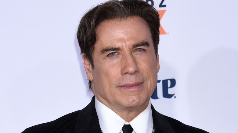 John Travolta frowning 