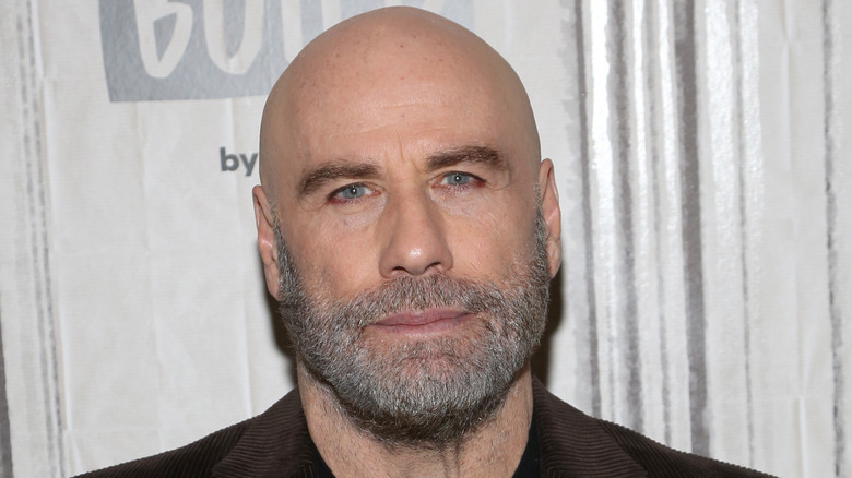 John Travolta frowning 