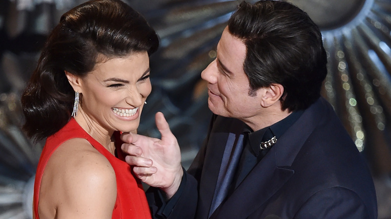 John Travolta touching Idina Menzel