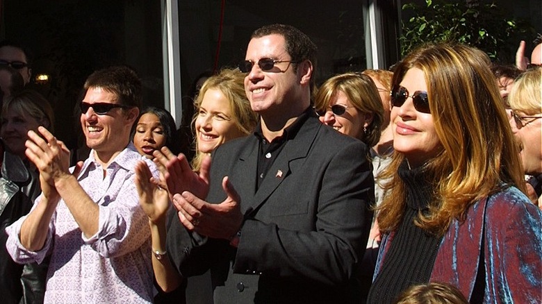 John Travolta, Tom Cruise, Kirstie Alley smiling at a Scientology event