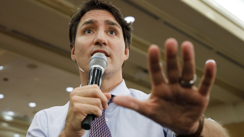 Justin Trudeau holding his hand out