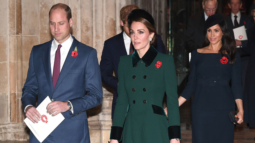 Prince William and Kate Middleton walking ahead of Prince Harry and Meghan Markle