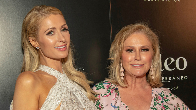 Paris and Kathy Hilton at an event, smiling